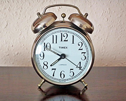 An old fashioned alarm clock on a table