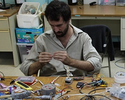 Peter Marting working on electronics for the Flick-o-matic