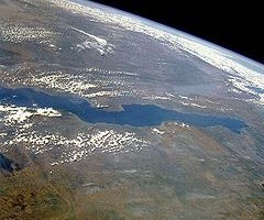 This is a photo of lake Tanganyika taken from a satellite. the lake runs from left to right across the middle of the image.