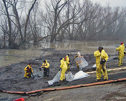 A team of people cleaning up a chemical spill