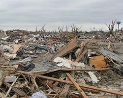 A picture showing the damage to property after an F5 tornado... no homes are left, only rubble.