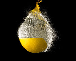 An image of a water balloon popping and spilling out water