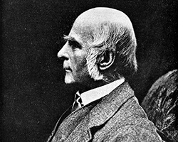 Francis Galton, an older man with white sideburns, in profile, looking to the left.