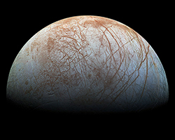 An image of Europa, one of Jupiter's moons, showing ice on its surface.