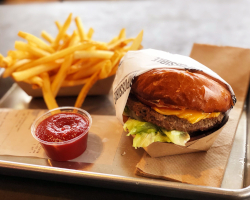 a vegetarian hamburger, fries and ketchup