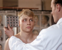 A doctor inspecting a patient's eye color in a movie about Nazi Germany