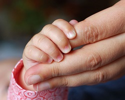 Baby touching hand, direct transmission
