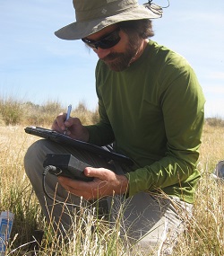 Dustin Wolkis recording soil metrics