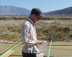 Eric Moody taking water samples