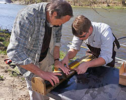 Biologists measuring a fish