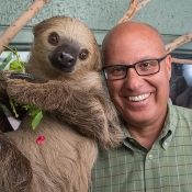 Bert Castro with a sloth at the Phonenix Zoo