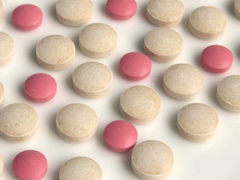 Pink and beige medical pills