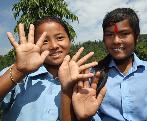 Nepal school girls showing off their clean hands