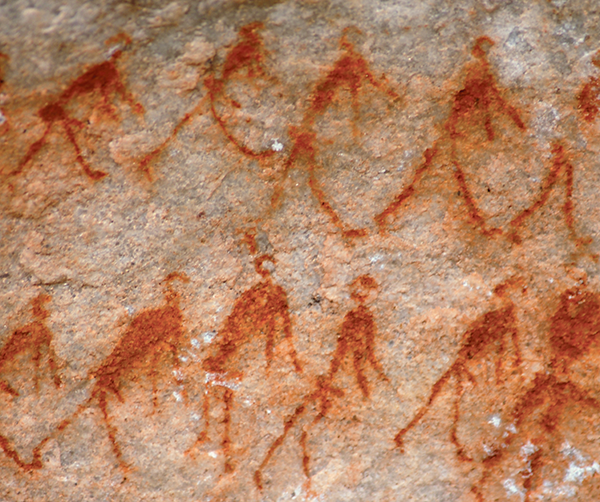 A rock painting showing groups of humans together