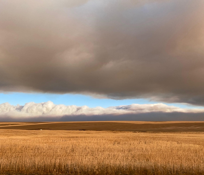 Smoke over agricultural fields by Karla Moeller